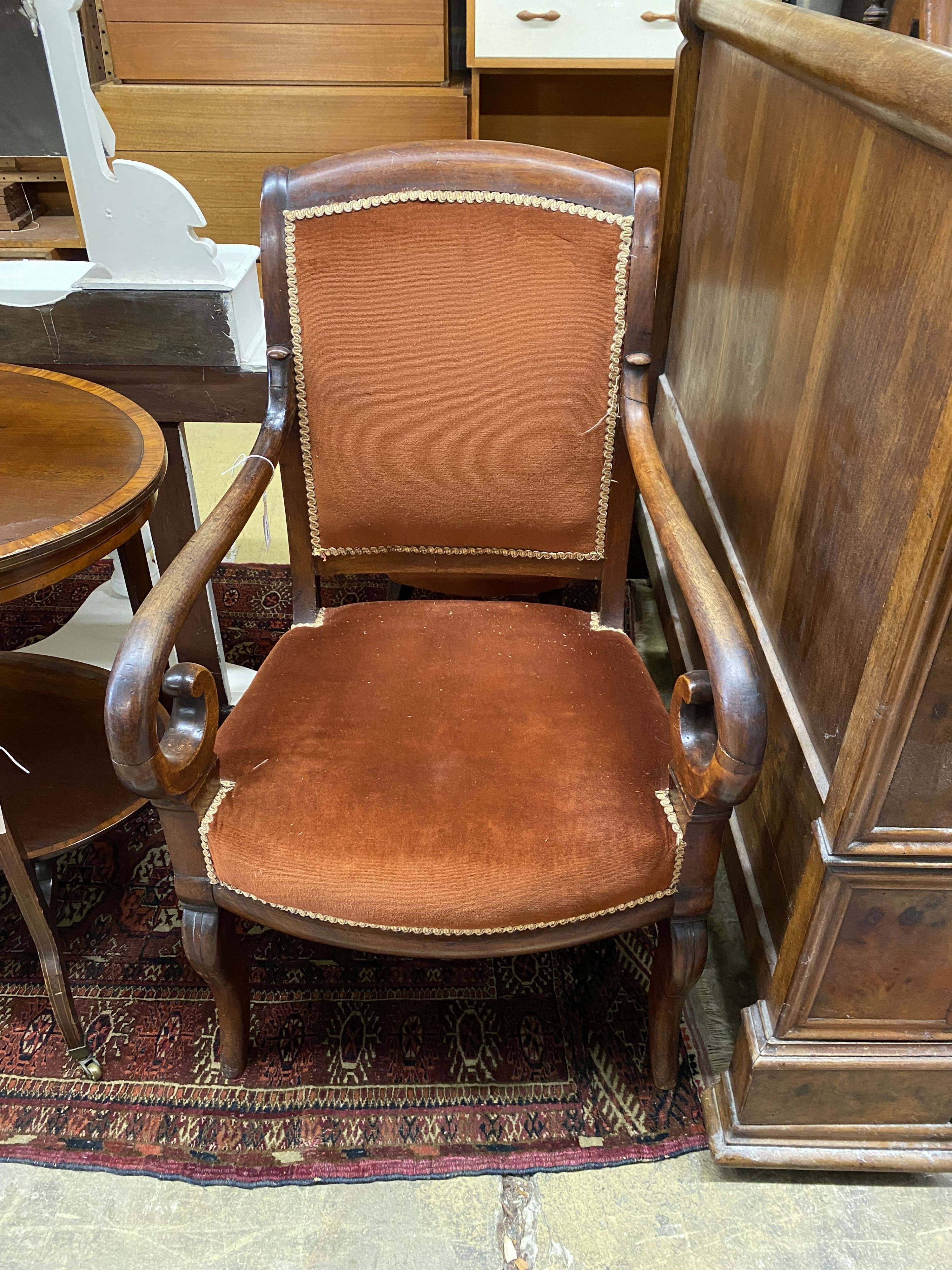 A French Empire mahogany fauteuil, with scroll over arms, width 56cm, depth 48cm, height 96cm